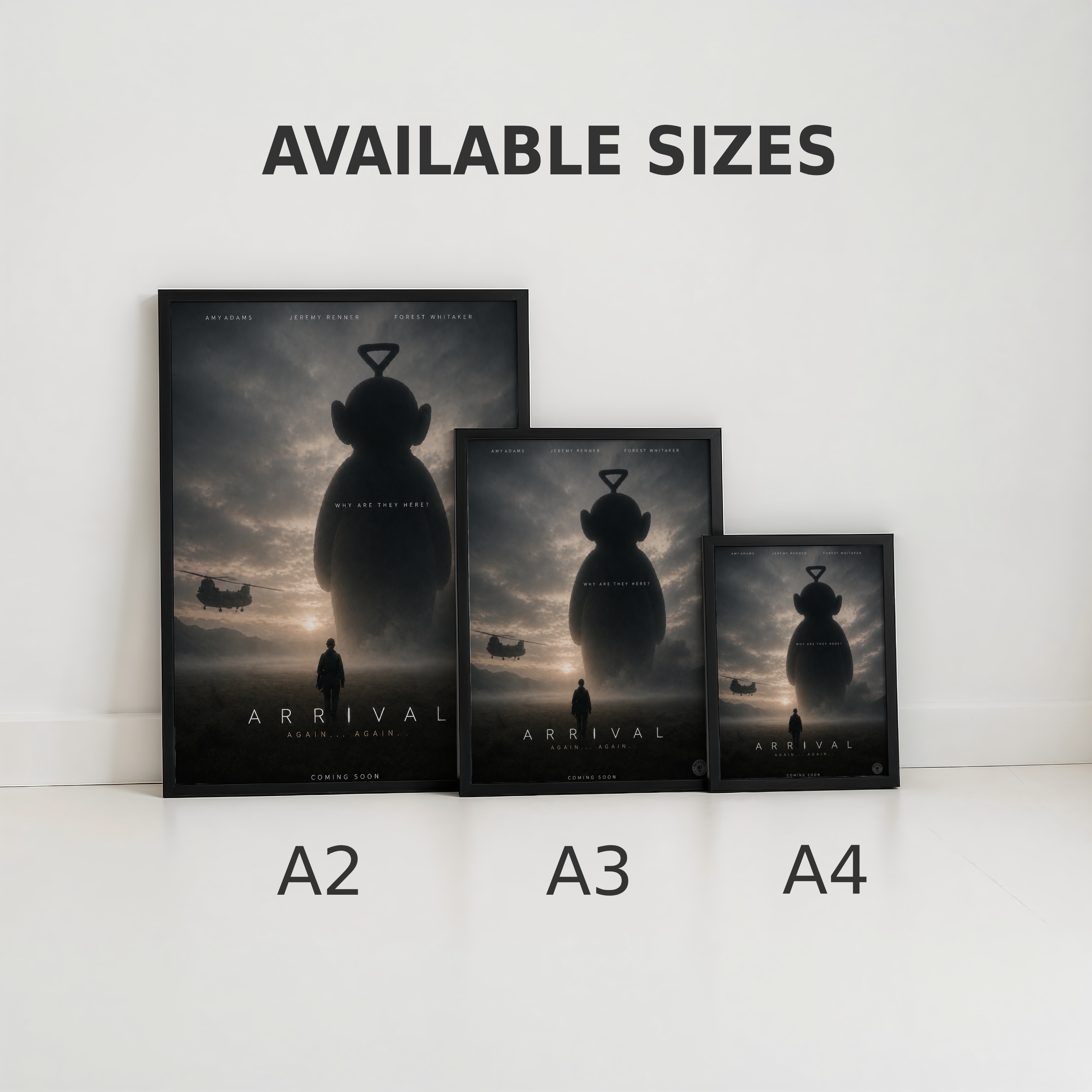 Three funny  'Arrival' teletubby movie posters of different sizes on a white surface with 'Available Sizes' text above.