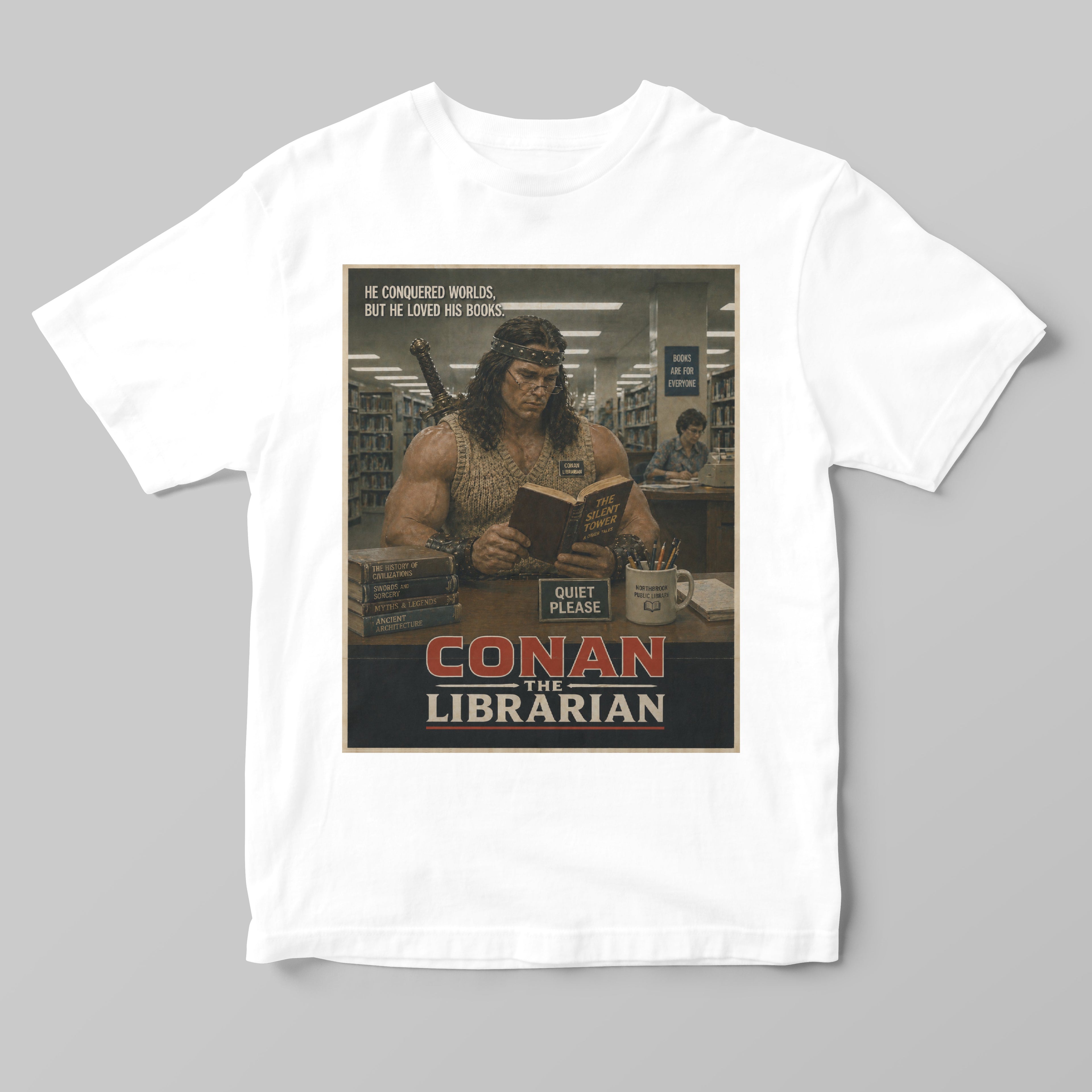 White t-shirt with a graphic of Conan the Barbarian in a library and text 'Conan the Librarian' on a gray background.