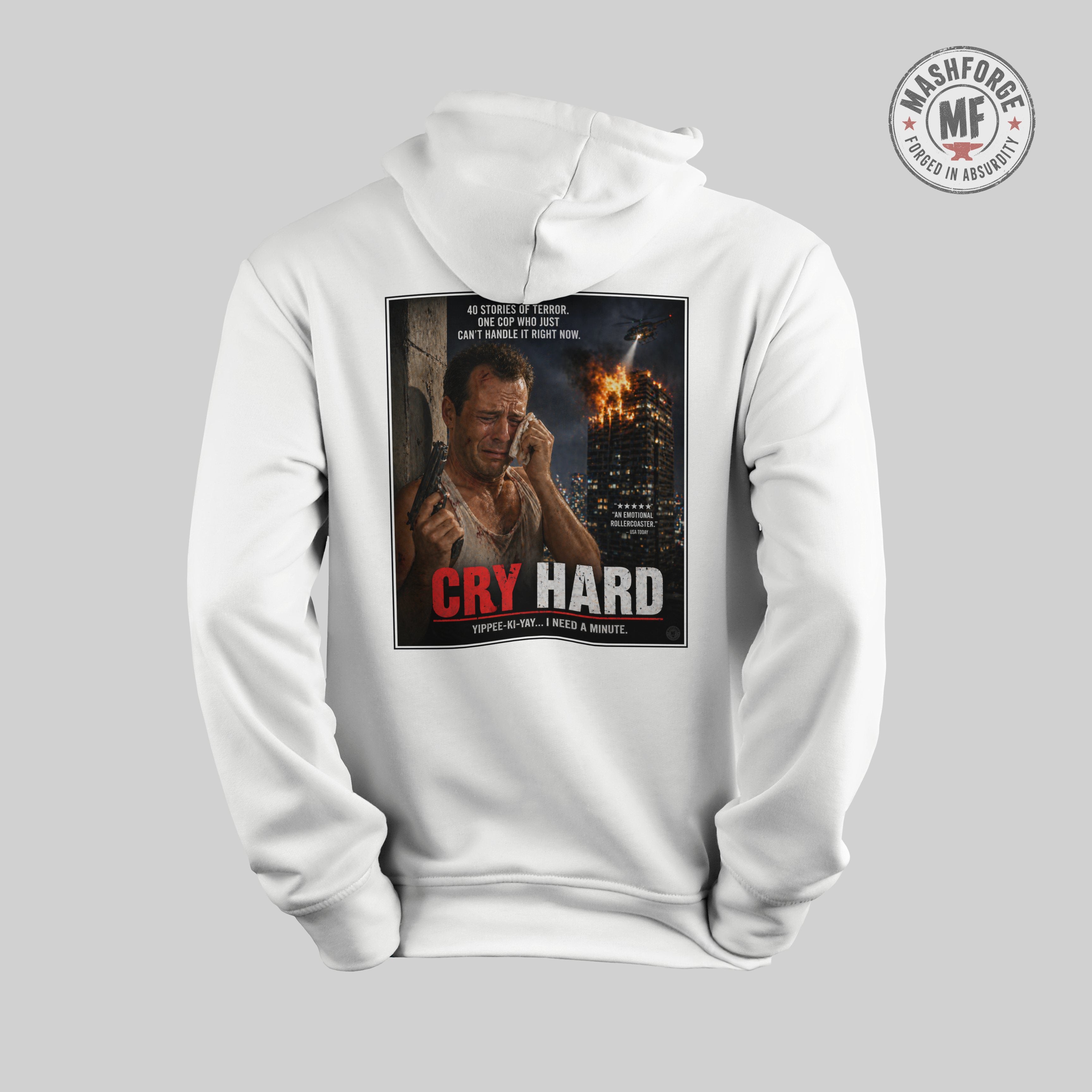 White hoodie with a graphic design on the front featuring a Die Hard movie poster and with a burning building in the background.