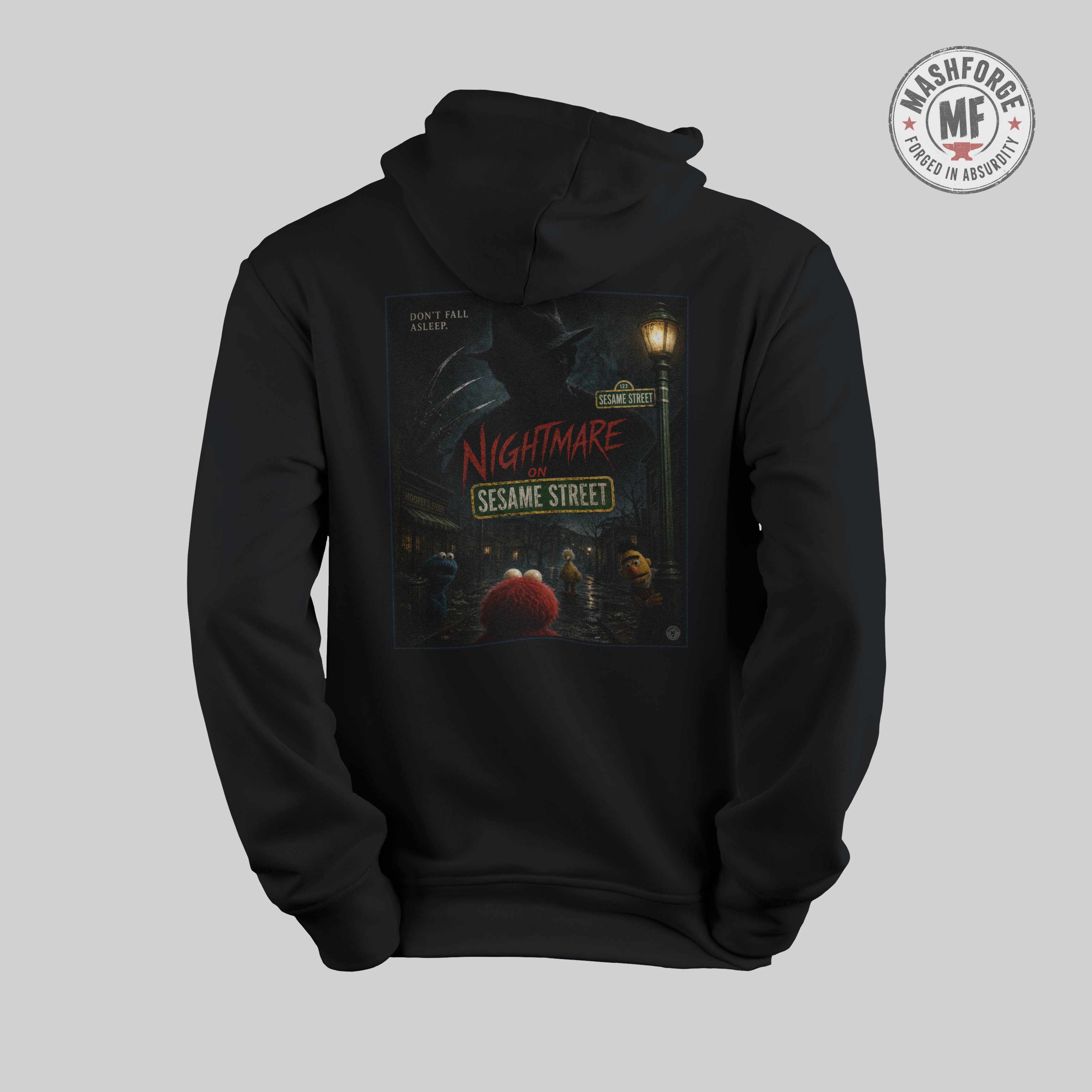Black hoodie with 'Nightmare on Sesame Street' graphic on a gray background