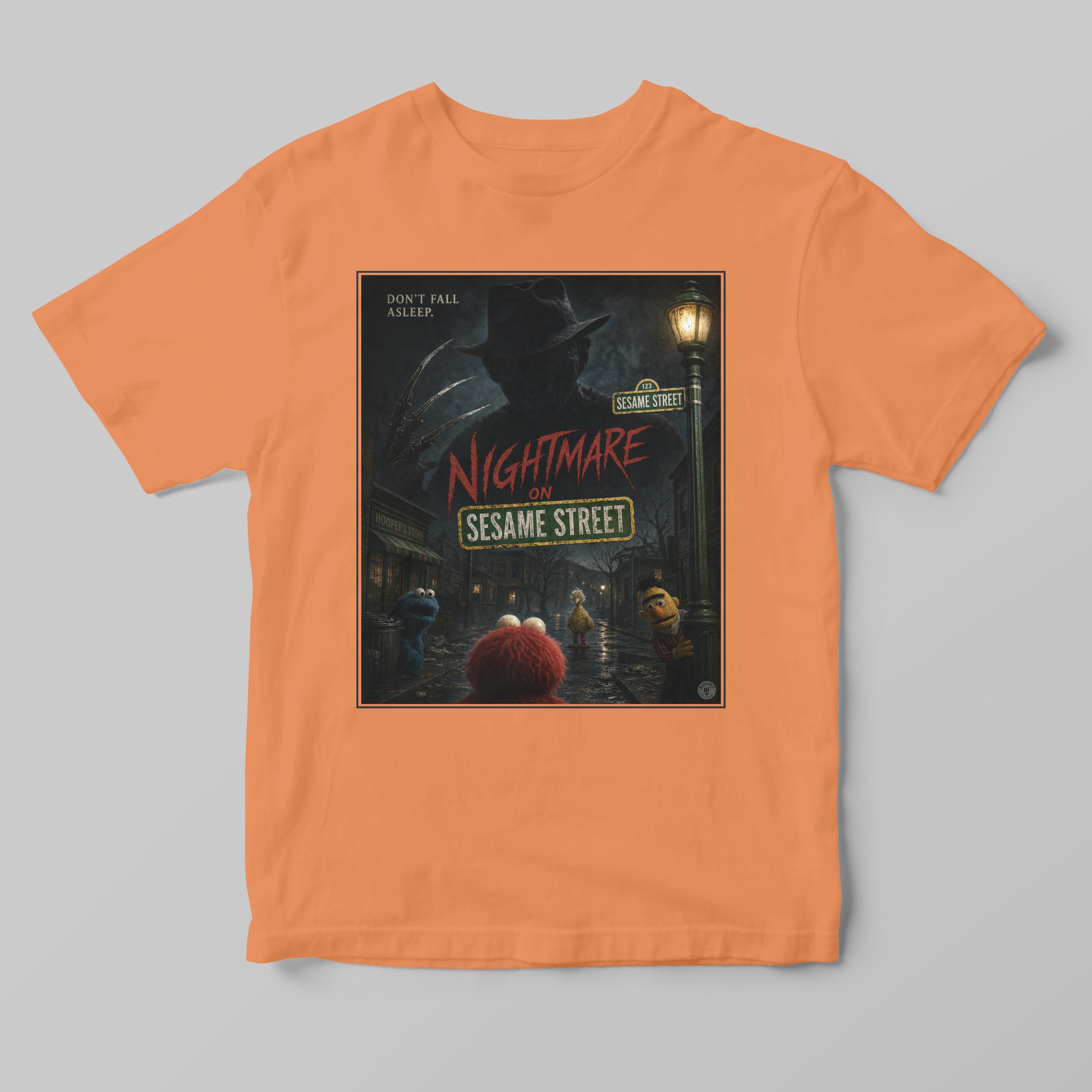 Orange t-shirt with 'Nightmare on Sesame Street' graphic design on a gray background