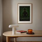 Framed poster titled the inspector Gadget matrix on a wall above a wooden table with a lamp, book, and candle.