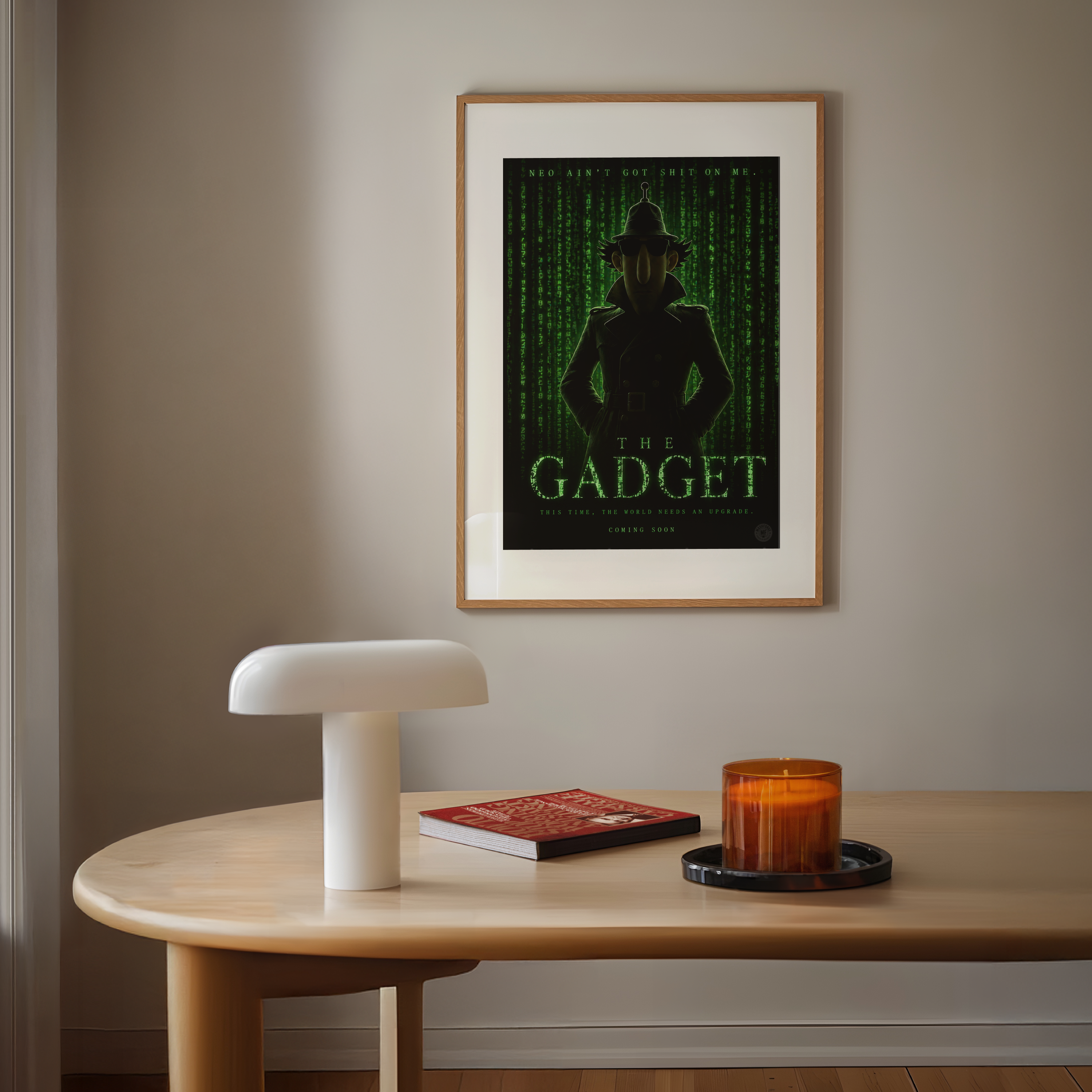 Framed poster titled the inspector Gadget matrix on a wall above a wooden table with a lamp, book, and candle.
