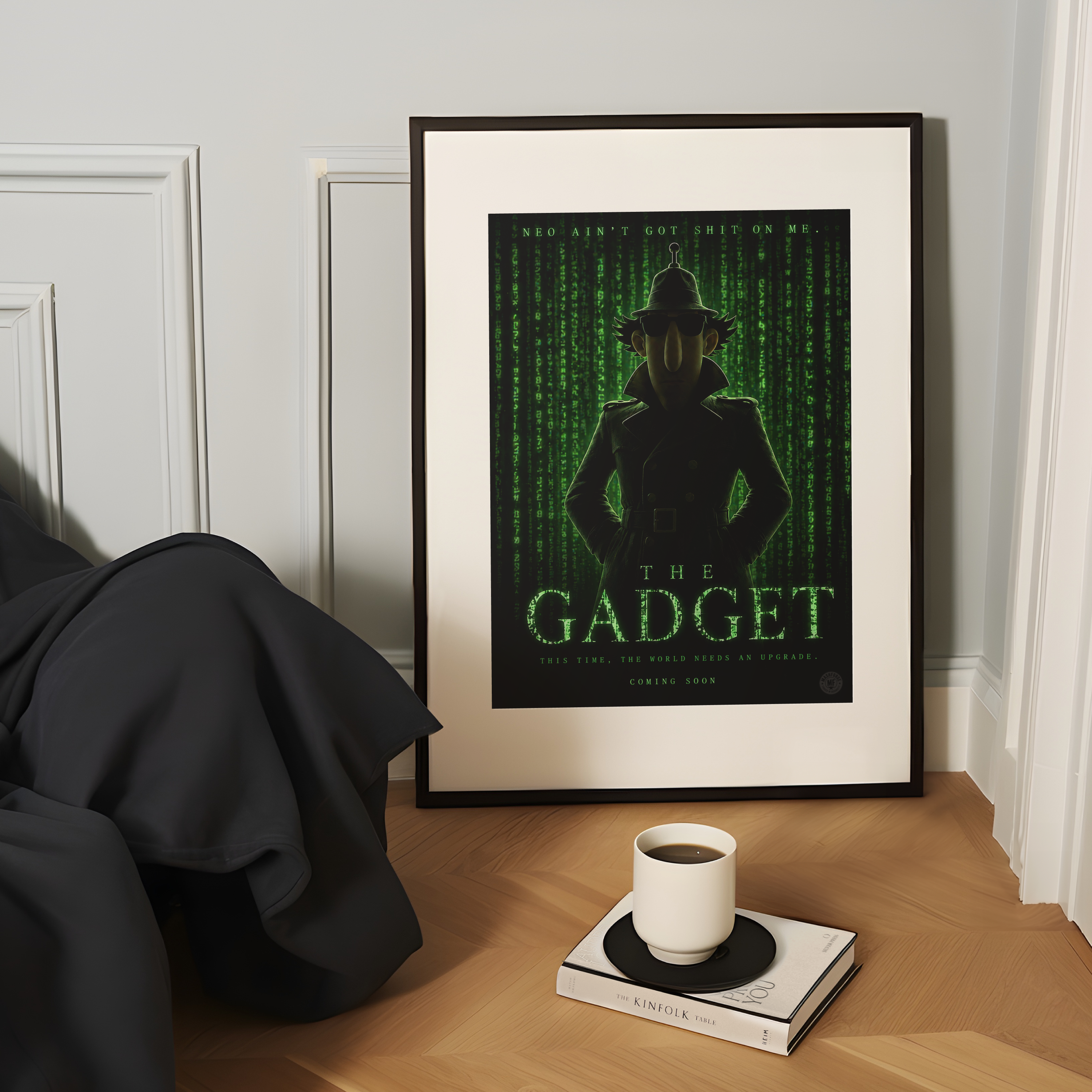 Framed movie poster of the Gadget matrix poster on a wooden surface with a cup and book.