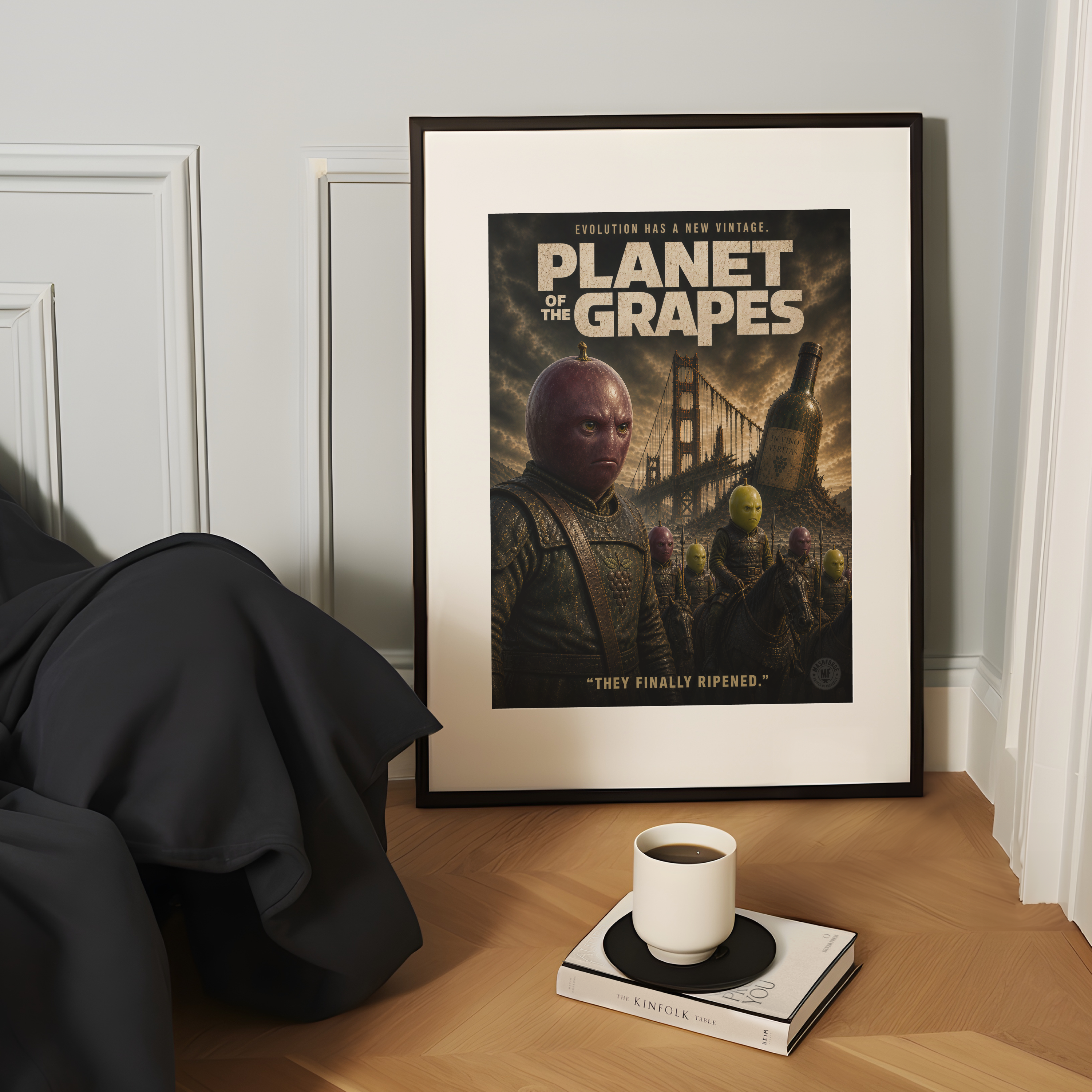Framed funny parody movie poster titled 'Planet of the Grapes' on a table with a cup and book.