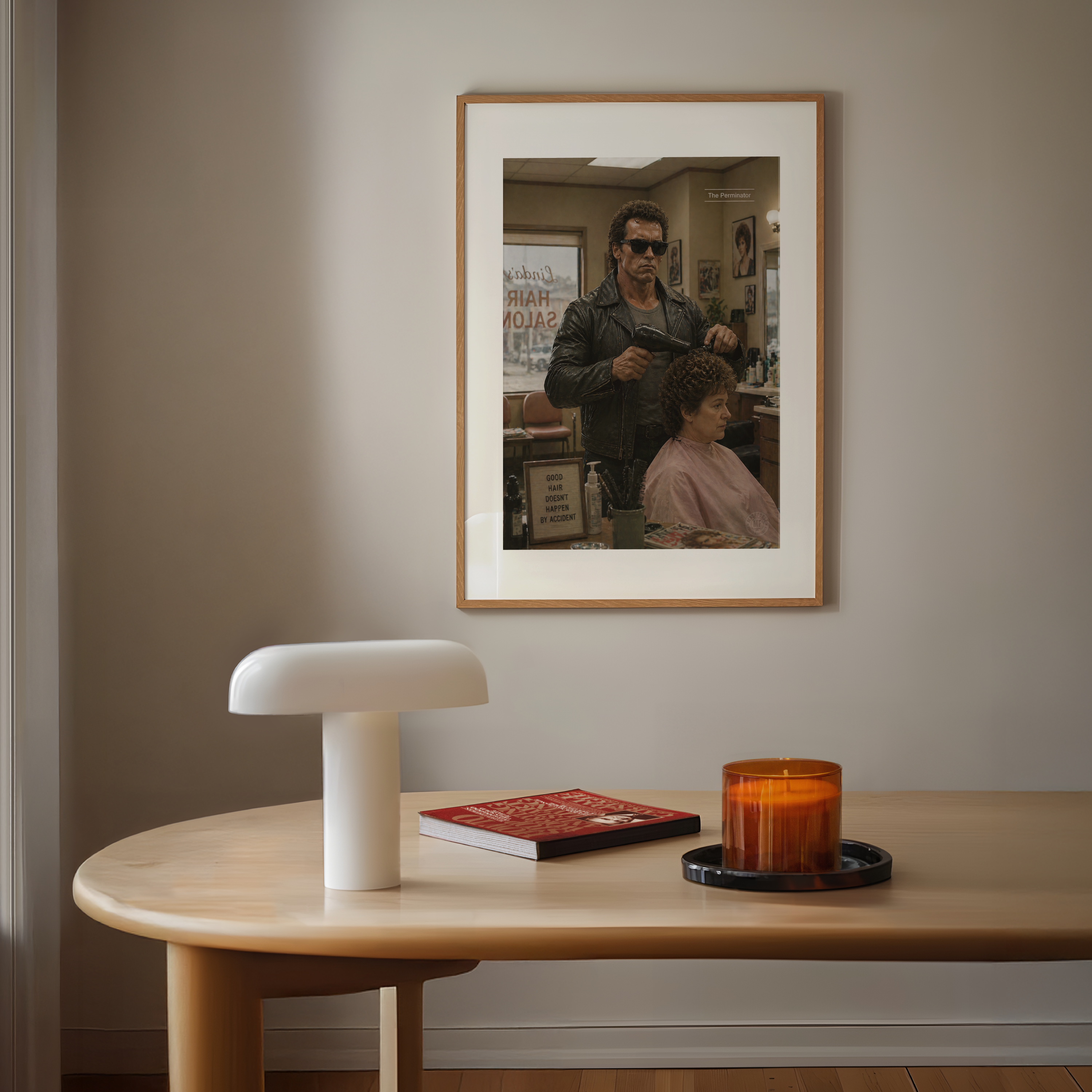 Framed the terminator photograph on a wall above a table with a lamp, book, and candle.