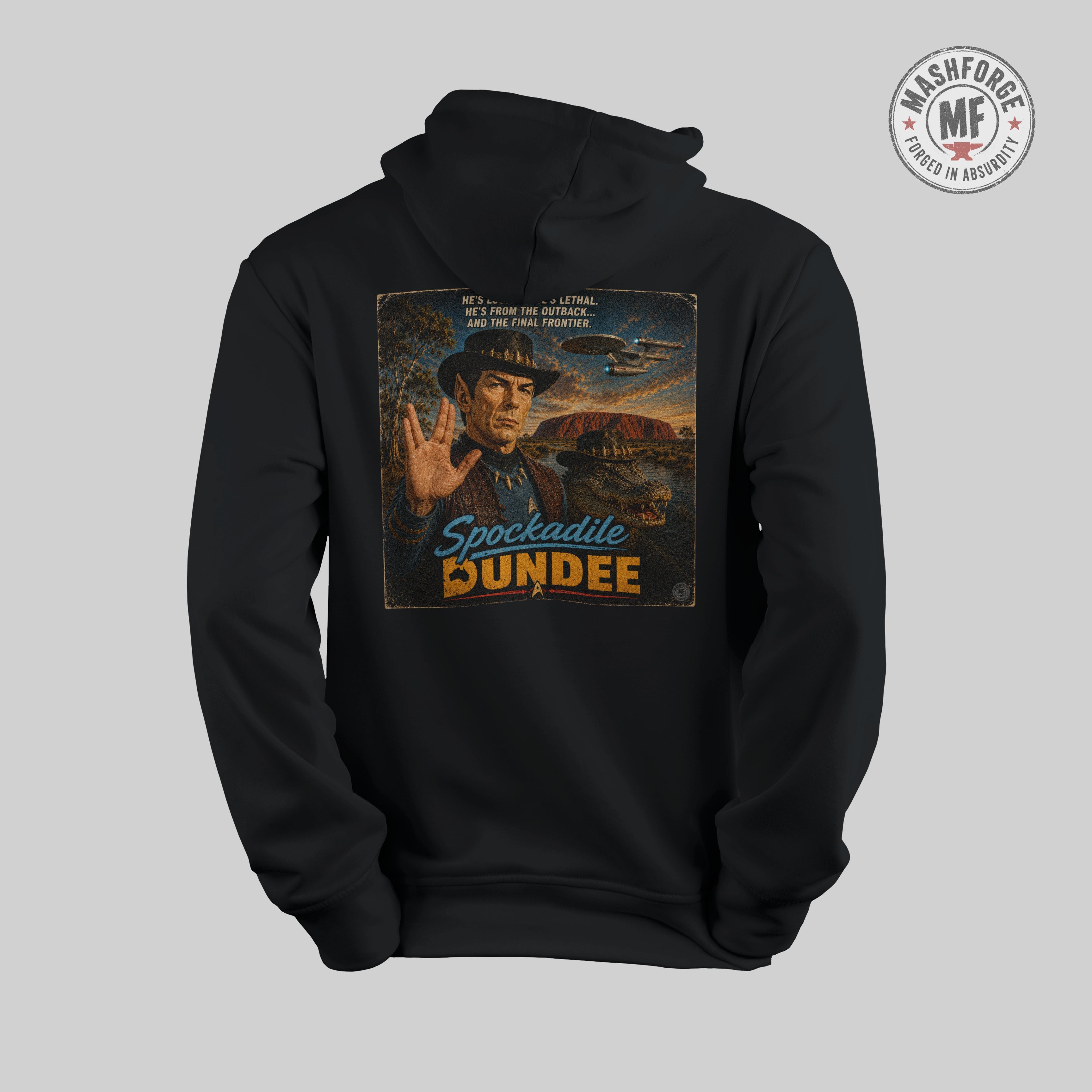 Black hoodie with a graphic design on the back featuring a person in a hat and text, on a light gray background.