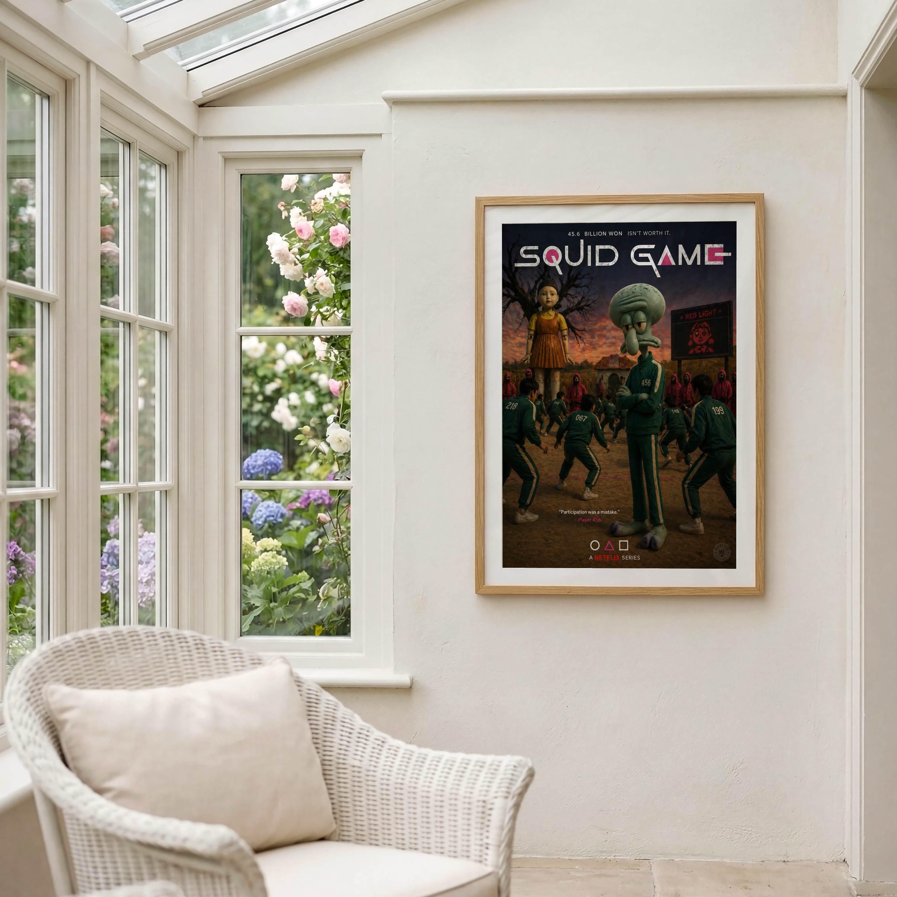Framed 'Squid Game' poster on a wall with a window view of flowers