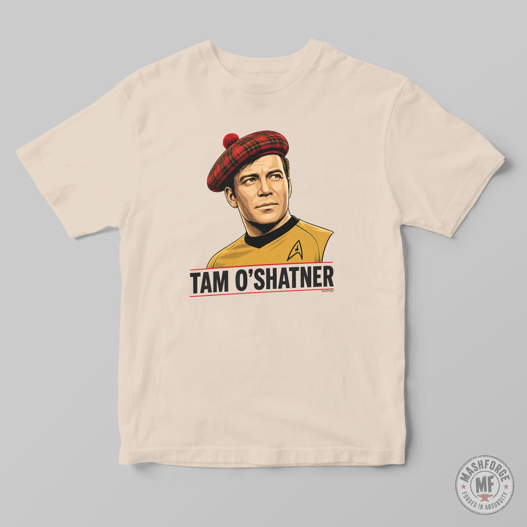 A cream-colored crewneck t-shirt featuring a graphic print of Captain Tam O'Shatner from Star Trek wearing a red tartan beret and a gold uniform, with the text 'TAM O'SHATNER' printed below. The t-shirt is displayed flat against a neutral gray background.
