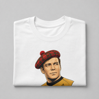 A folded white crewneck t-shirt featuring a stylized graphic illustration of a man in a red tartan beret and a gold Star Trek uniform, set against a solid gray background.