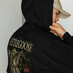 Person wearing a black hoodie with 'Beetlegoose' design on the back, against a plain background.