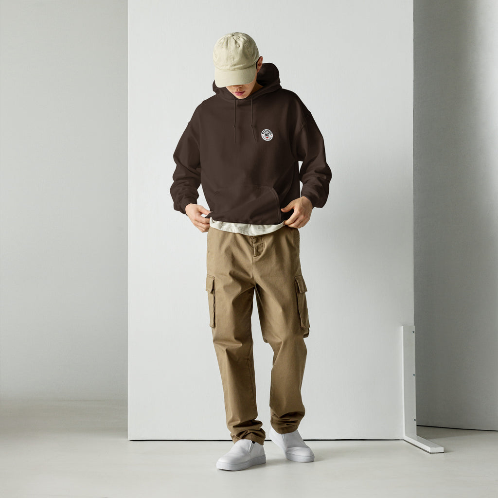 Person wearing a maroon hoodie with MashForge logo, beige cap, and brown cargo pants against a white background