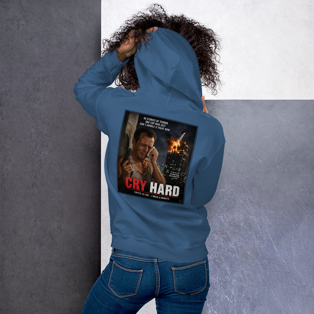 Person wearing a blue hoodie with 'Cry Hard' graphic on the back against a gray background