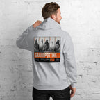 Person wearing a hoodie with 'Grainspotting' graphic on the back against a white brick wall.