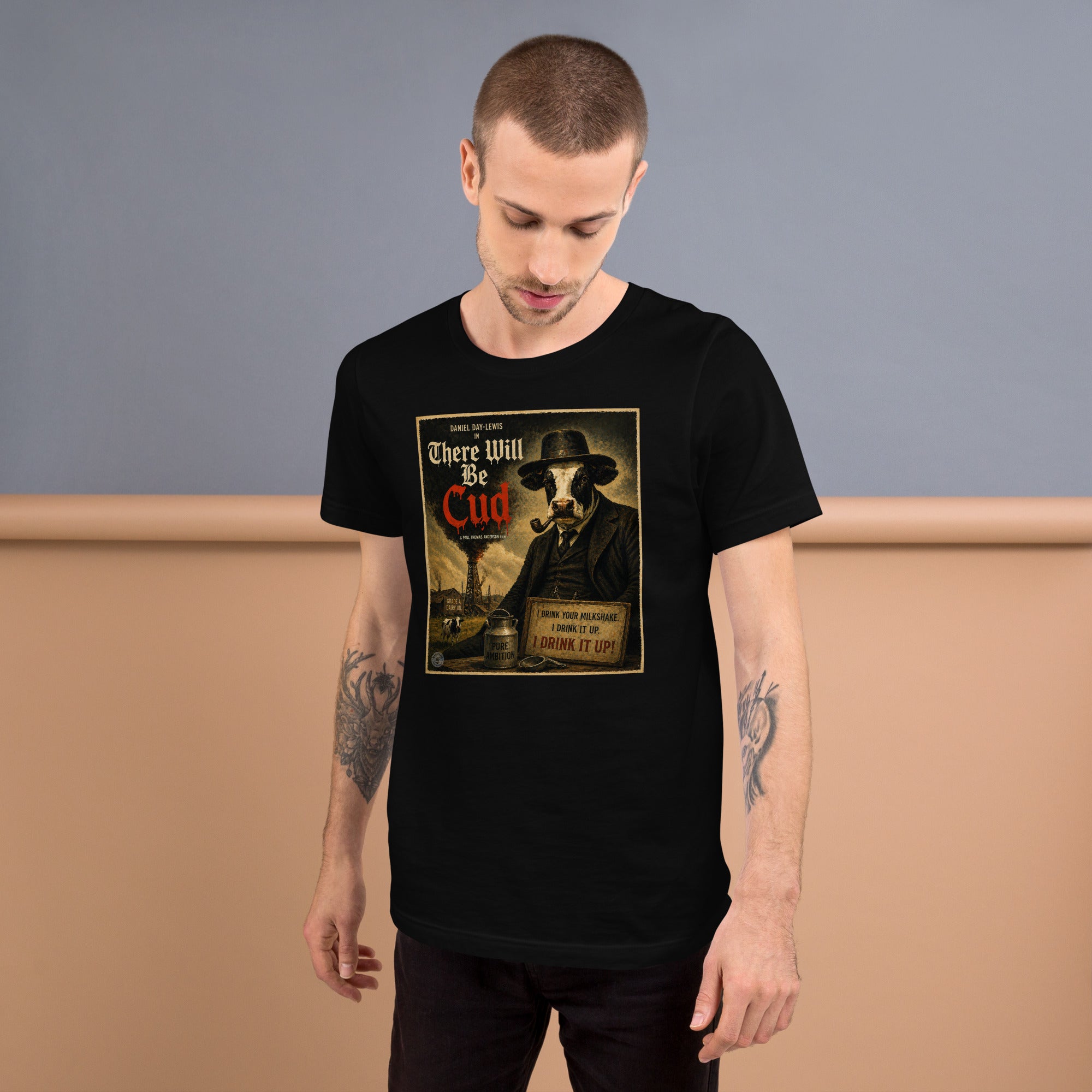 a man wearing a black tshirt with a funny there will be cud cow print