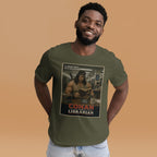 Man wearing a green t-shirt with a funny 'Conan the Librarian' graphic design on a beige background