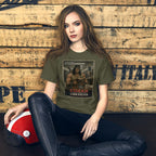Person wearing a t-shirt with a graphic design sitting against a wooden wall.