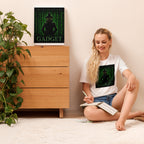 Woman sitting on the floor with a book, wearing a white t-shirt with a graphic design, in a room with a wooden dresser and plant.