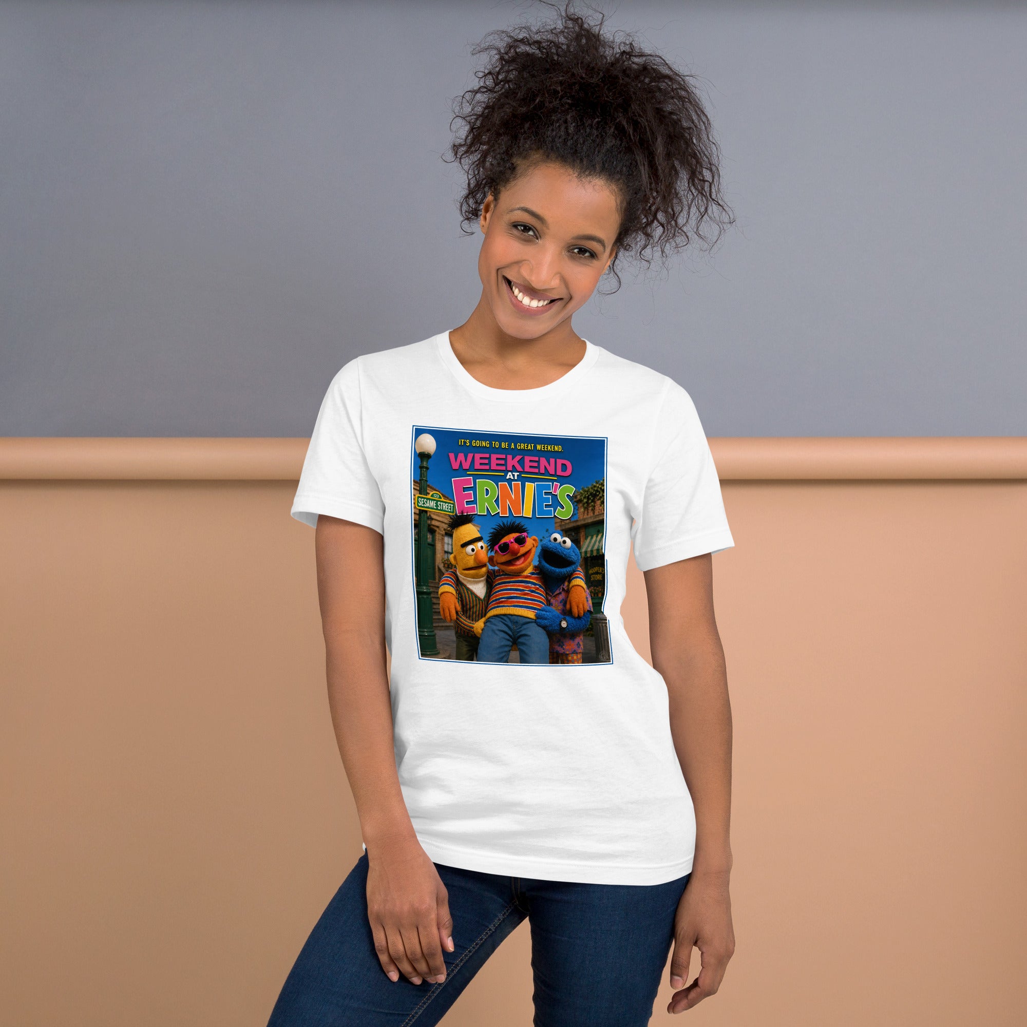 Person wearing a white t-shirt with a funny graphic design of two parody characters from sesame street on a plain background.