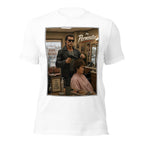 White t-shirt with a funny barbershop graphic of a woman getting a perm in a barbershop, titled 'The Perminator'.