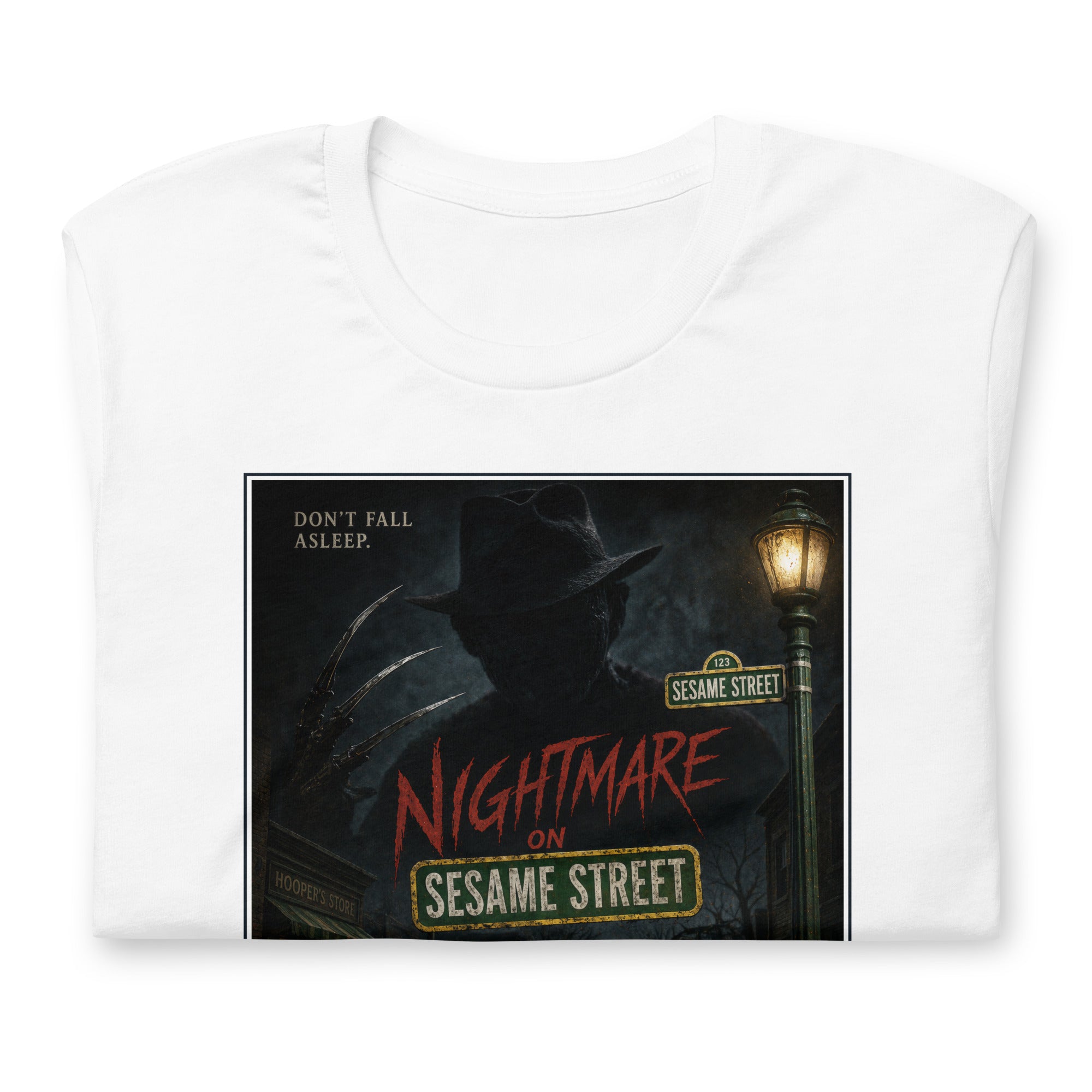 White t-shirt with 'Nightmare on Sesame Street' graphic design featuring a reddy Krueger figure and street lamp.