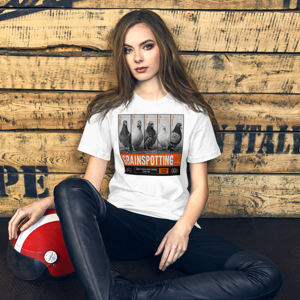 Person wearing a 'Grainspotting' t-shirt sitting against a wooden wall.