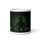 Mug with Matrix-themed design featuring text and an inspector gadget silhouette on a white background